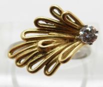 An 18ct white gold ring with yellow metal butterfly design set with a diamond of approximately 0.