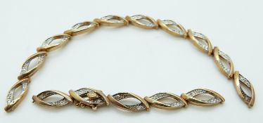 A 9ct gold section of bracelet set with diamonds,