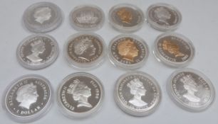 Silver Royal Commemorative crown sized coins in capsules,