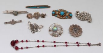 A silver pendant in the form of a pixie, silver brooch set with moss agate,