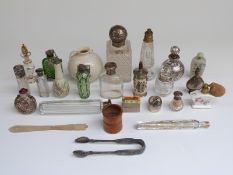 Five hallmarked silver mounted dressing table bottles, green glass scent bottle,