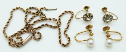 A pair of 9ct gold earrings set with paste,