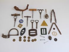 Collection of buckles including retro plastic examples, corkscrews, tokens from Cotswold Inn,