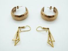 A pair of 14ct gold earring in the form of two triangles,