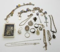 Two silver bracelets with enamel shield charms, four silver rings, two silver St Christophers,