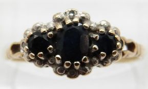 A 9ct gold ring set with sapphires and diamonds,