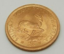 A 1965 gold South African two rand with MDM certificate