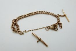 A 9ct rose gold curb link bracelet (originally a fob chain) with two T bars and clip, 40.
