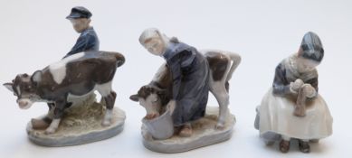Three Copenhagen figures, a girl feeding a cow,