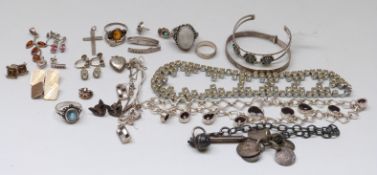 A silver bangle, fob chain, four silver rings, silver necklaces, garnet necklace, silver cufflinks,