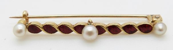 A gold brooch set with red enamel and three pearls, 3g, L3.