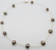 An 18ct gold necklace set with pearls