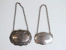 Two hallmarked silver bottle tickets, one brandy,