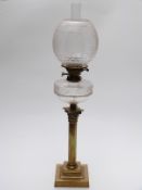 Brass Corinthian column and cut glass oil lamp,