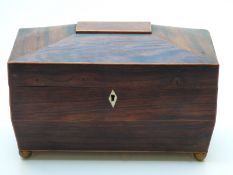 Rosewood twin handled sarcophagus-shaped tea caddy with two compartments flanking mixing bowl,