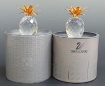 Two Swarovski Crystal cut glass gold plated mounted Pineapples, each 10cm tall,