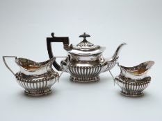 Victorian hallmarked silver three piece bachelor's tea set with reeded lower section,