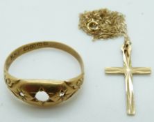 An 18ct gold ring, 2.4g and a gold cross and chain, 0.