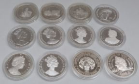 Silver Royal Commemorative crown sized coins in capsules,