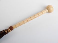 Late 19thC/20thC parasol with carved ivory handle and spherical knop on hardwood stick,