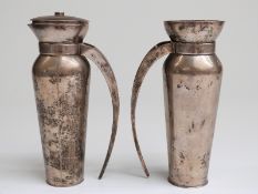A pair of Revissant Indian white metal jugs with retro wood inset handles, one with lid,