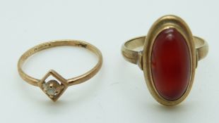 A yellow metal ring marked 333 set with an agate cabochon and a 9ct gold ring set with a diamond