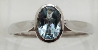 A 9ct white gold ring set with an oval aquamarine,