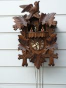 Three train Black Forest German cuckoo clock with musical movement