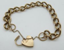 A 9ct gold curb link bracelet with a 9ct gold heart padlock clasp, 23.