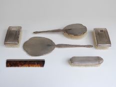 Hallmarked silver dressing table set comprising hand mirror and two brushes,
