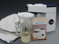 Vintage Kenwood Chef food mixer with accessories and recipe book