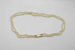 A classic strand of pearls with 9ct gold clasp.