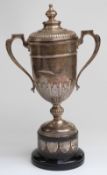 George V hallmarked silver commemorative covered trophy cup on plinth with dedication to John