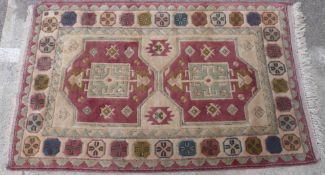 Fachralo style carpet with two central Memling type guls surrounded by multi-coloured octagonal