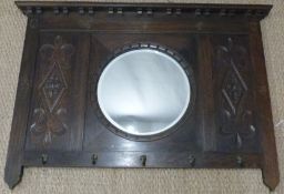 Oak wall mounted coat rack with bevelled circular mirror,