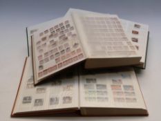 Three large stockbooks of mint GB QEII stamps, singles and blocks with traffic lights,