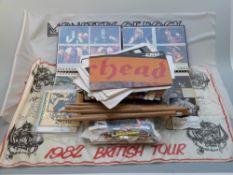 A collection of rock concert related items including hand bills, flyers, ticket stubs, drum sticks,