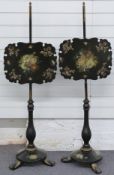A pair of hand decorated papier maché pole screens in the style of Betteridge,