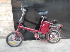 An electric folding bicycle in red