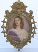 19thC portrait miniature of a lady in ornate brass frame, indistinctly signed possibly Opic,
