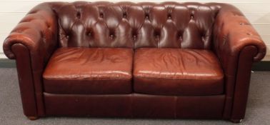 Leather Chesterfield two-seat sofa in oxblood red,