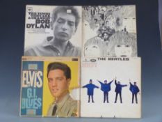 Approximately 40 LPs in a case, includes The Beatles,