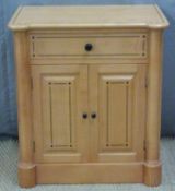 Satinwood two door cupboard with drawer above and inlaid decoration,