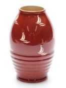 Clarice Cliff vase decorated with boats on a red ground, no 692 to base,
