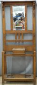 Early 20thC oak hall stand with bevelled mirror to back,