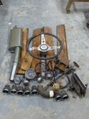 A quantity of Ford Cortina parts including steering wheel, instruments,