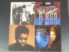 Approximately 40 records of mixed genres and artists including folk