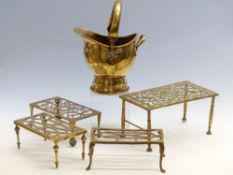 Four 19thC brass trivets and a small brass coal scuttle