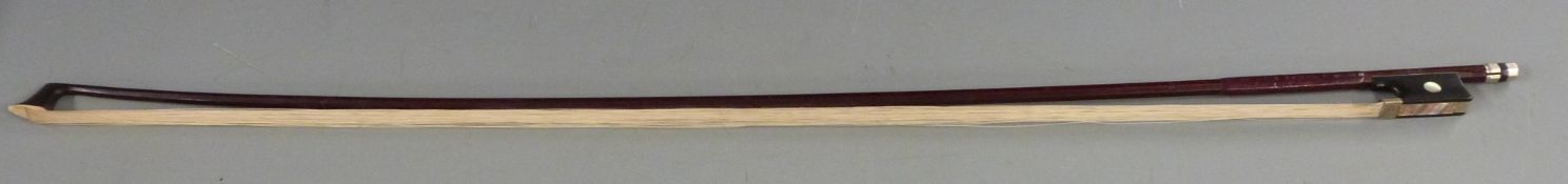 Tourte violin bow the ebony frog inset with mother of pearl eye and silvered decoration