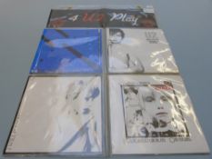 U2 - 4 U2 Play four singles in display pack.